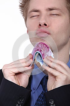 Young man holding bank notes