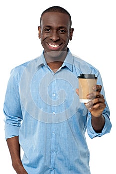 Young man holding beverage cup
