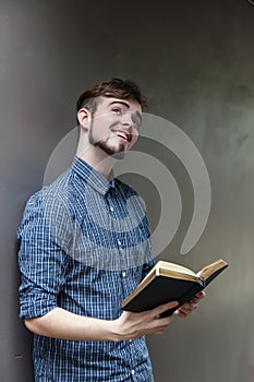 Young man holding a bible, Student with  book