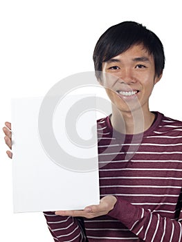 Young man holding a blank canvas