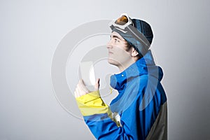 Young man holding blank lift admission ticket