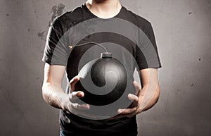 Young man holding a bomb