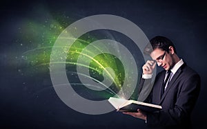 Young man holding book with wave