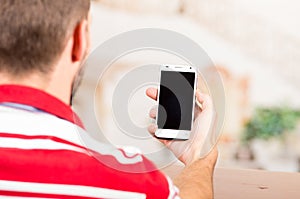 Young man holding cellphone