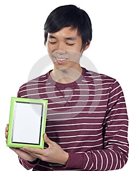 Young man holding an empty picture frame