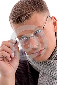 Young man holding eyewear