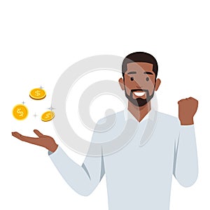 Young man holding a gold coin. Earning money