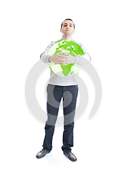 Young man holding green planet earth