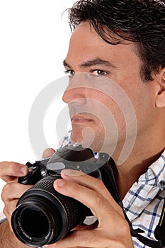 A young man holding his camera for a shoot