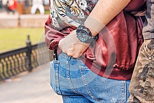 Young man holding his girlfriend by the waist