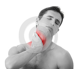 Young man holding his neck in pain, isolated