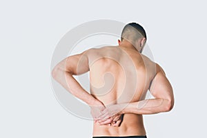 Young man holding his neck in pain. Medical concept