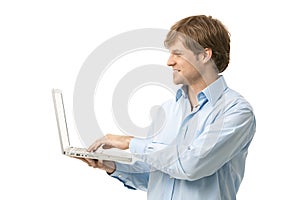 Young man holding laptop