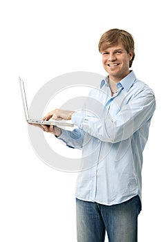 Young man holding laptop