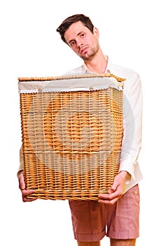 Young man holding a large flasket