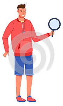 Young man holding magnifying glass. Searching person