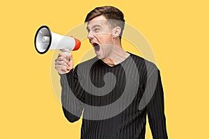 The young man holding a megaphone