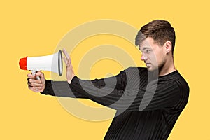 The young man holding a megaphone