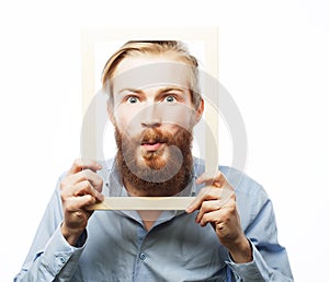 Young man holding picture frame