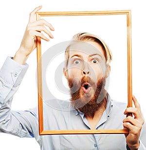 Young man holding picture frame