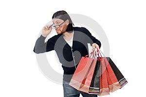 The young man holding plastic bags