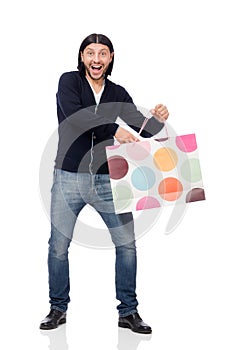 The young man holding plastic bags isolated on white