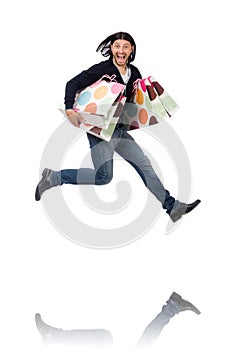 The young man holding plastic bags isolated on white