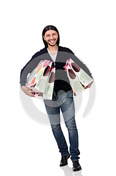 The young man holding plastic bags isolated on white