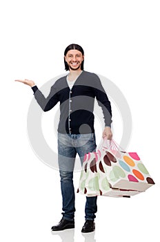 The young man holding plastic bags isolated on white