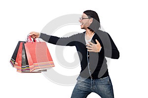 The young man holding plastic bags isolated on white