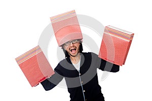 The young man holding plastic bags isolated on white