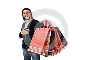 Young man holding plastic bags isolated on white