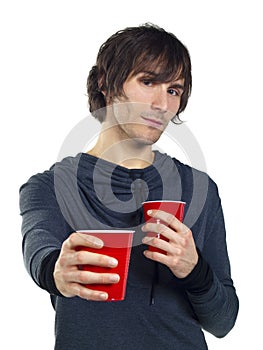 Young man holding plastic drinking cups