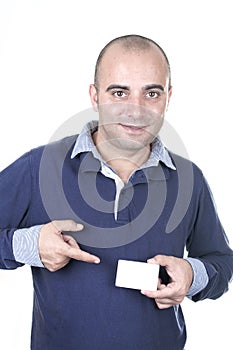 Young man holding and showing card