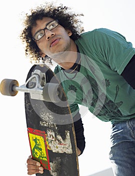 Young Man Holding Skateboard