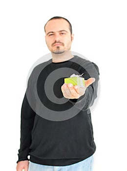 Young man holding small gift(focus on gift)