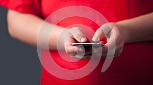 Young man holding smarthphone in hand