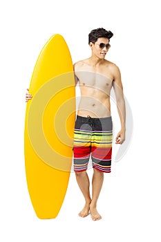 young man holding surfboard