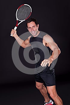 Young Man Holding Tennis Racket