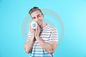 Young man holding toilet paper roll