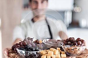 Young man holding a tray with a healthy Breakfast