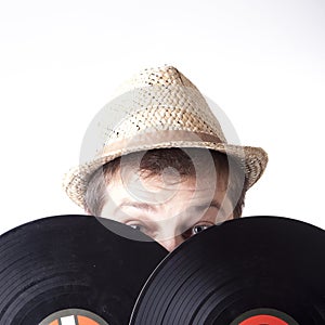 Young man holding two vinyl LP-s