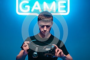 Young man holding VR glasses. Strat games.