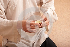Young man holds a Chinese tea ceremony