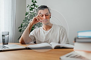 Young man at home while  distance learning