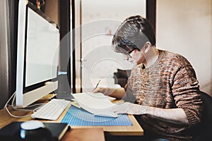 Young man at home using a computer