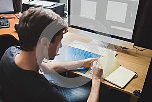 Young man at home using a computer