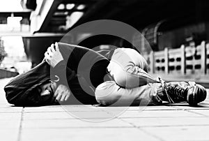 Young man homeless sleep on the street