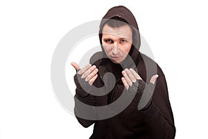 Young man in a hoodie standing in a fighting stance