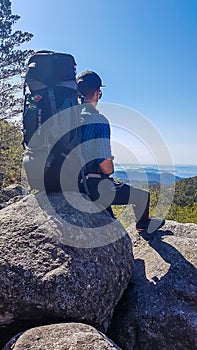 Norway - A young man and a big hiking backpack